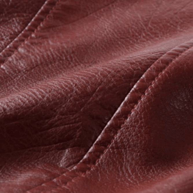 Back view of women's insulated winter jacket, slim fit and belted, great for cold weather style.