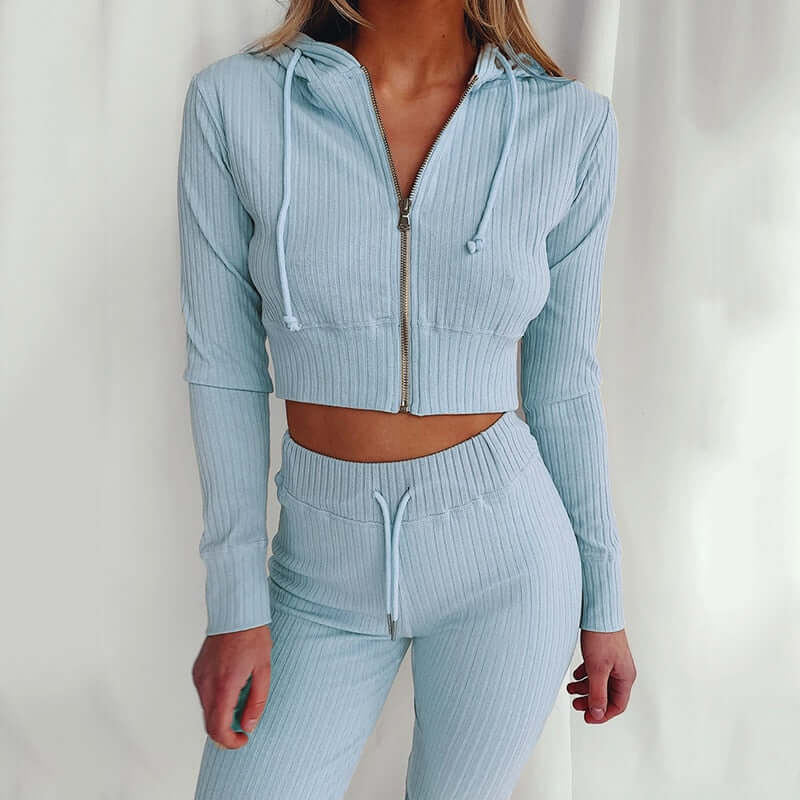 Polyester women's slim fit tracksuit with hoodie, ideal activewear for casual style.