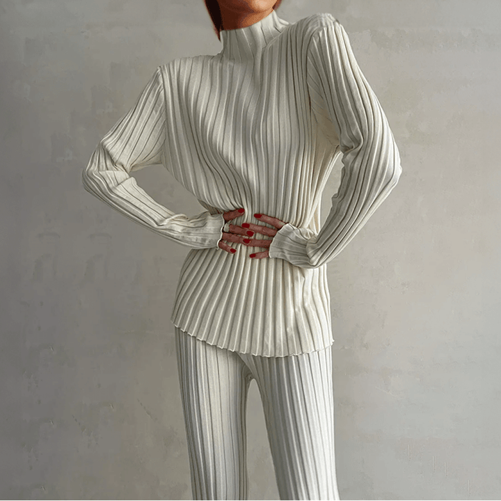 Chic women's ribbed knit two-piece set with a stylish turtleneck top and comfortable slim fit knit trousers.