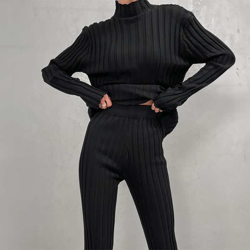 Soft ribbed knit women's two-piece set, slim fit design featuring a turtleneck top and comfortable knit trousers.