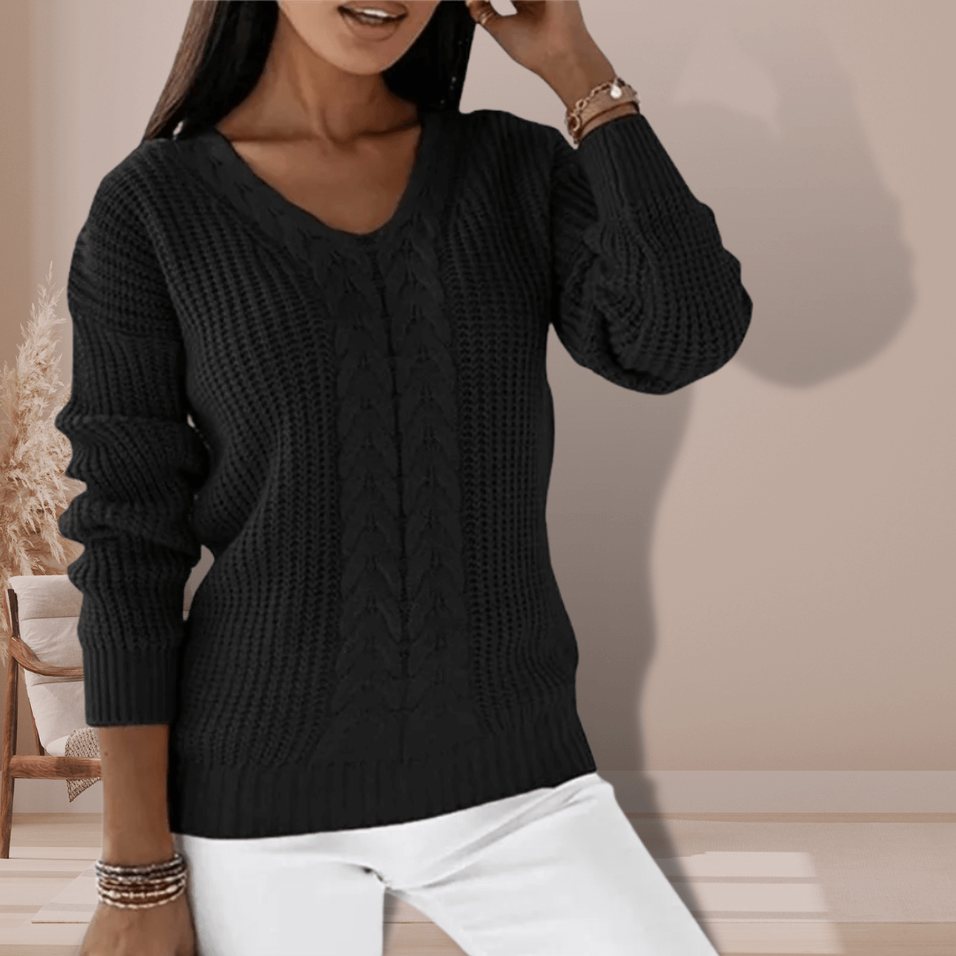 Close-up: soft knitted V-neck pullover for women. Slim fit polyester long-sleeve sweater, cozy fall/winter fashion.