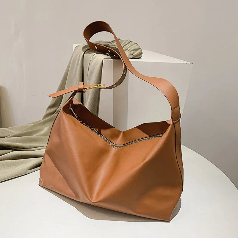 Modern women's slouchy tote bag with a long shoulder strap, an ideal everyday fashion statement.