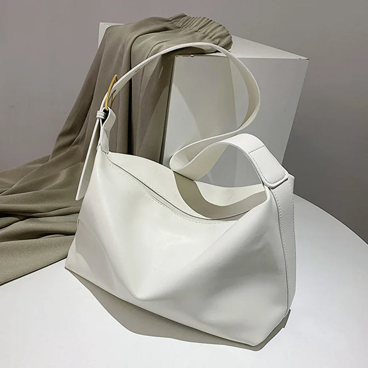 Functional and stylish women's faux leather shoulder bag: a slouchy tote with generous internal space.