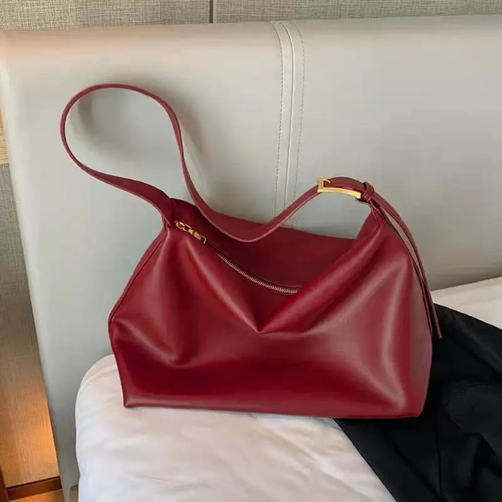 Everyday essential: a women's slouchy tote bag, versatile and roomy, designed to be worn on the shoulder.