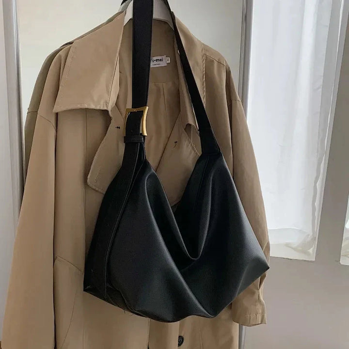 Women's fashion accessory: a slouchy shoulder tote bag designed for comfort and spacious carrying.