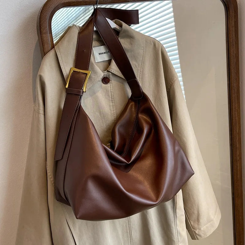 This large capacity women's slouchy tote bag, made from durable faux leather, is a perfect shoulder companion.