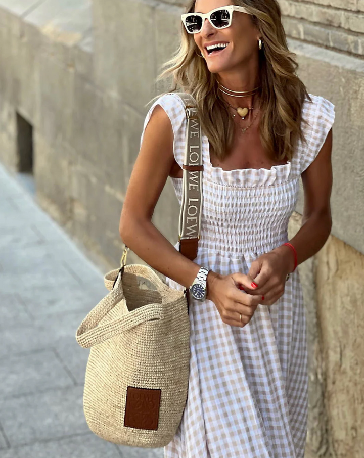 Women's casual smocked gingham maxi dress with charming ruffle sleeves, great for a day out or vacation.