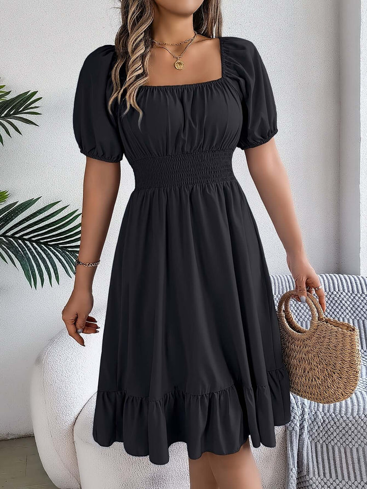 Elegant women's midi dress with a smocked bodice, stylish puff sleeves, and a flowy A-line design.