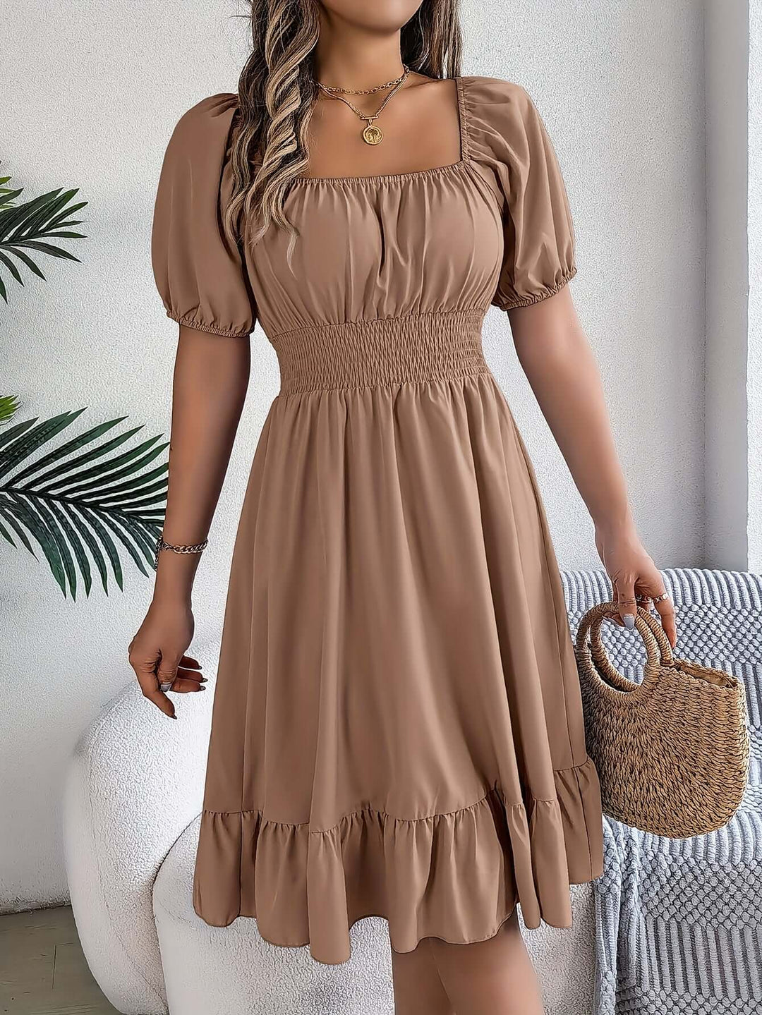 Comfortable women's smocked midi dress with puff sleeves & ruffles, perfect for casual summer days.