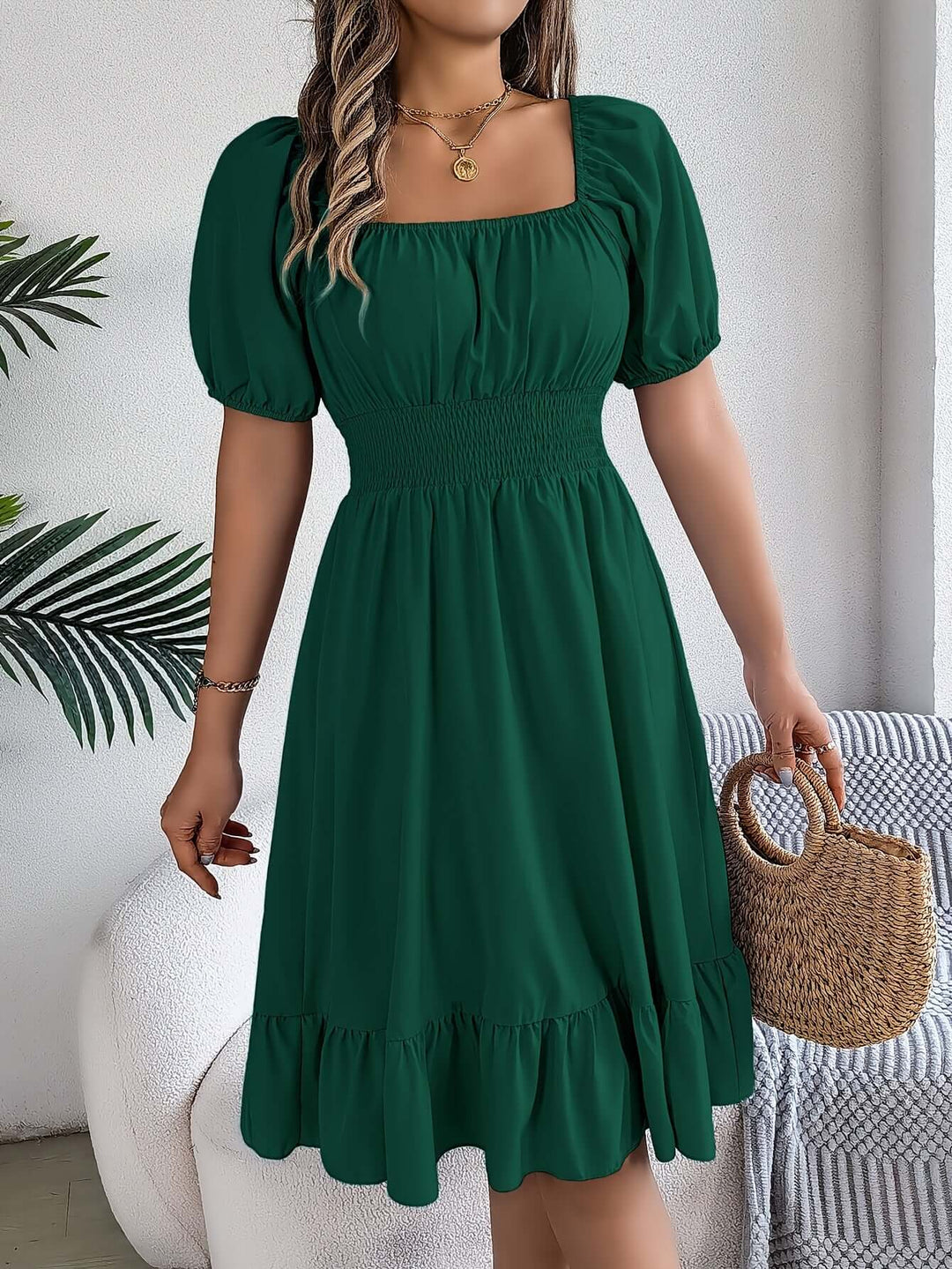 Elegant rayon blend A-line midi dress for women, featuring smocking and chic puff sleeves.