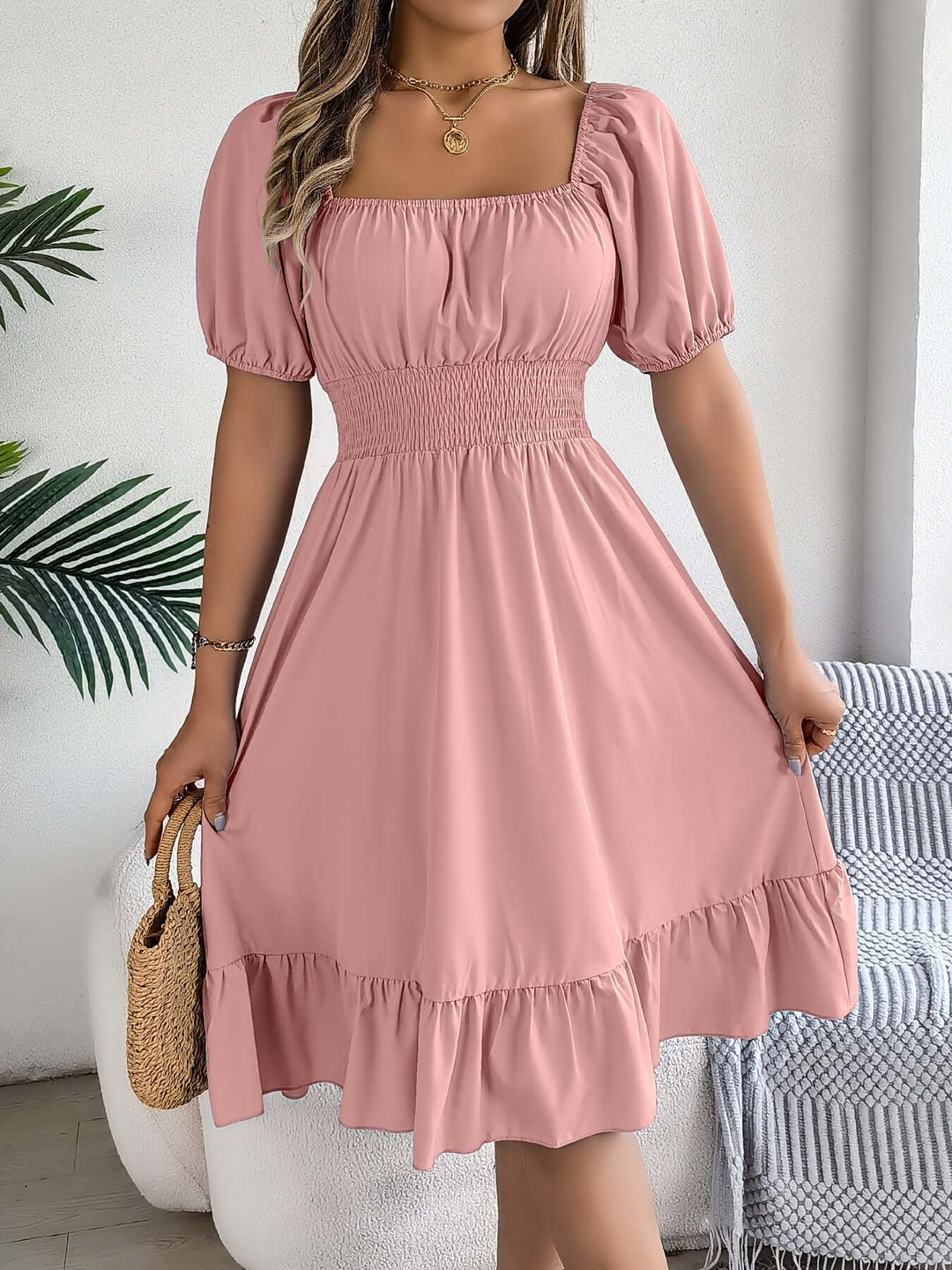 Soft rayon blend women's smocked midi dress. Comfortable puff sleeve A-line for casual elegance.