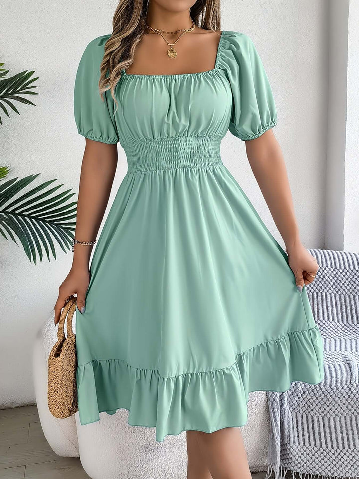 Chic women's smocked midi dress with trendy puff sleeves, ruffles, and a flattering A-line silhouette.