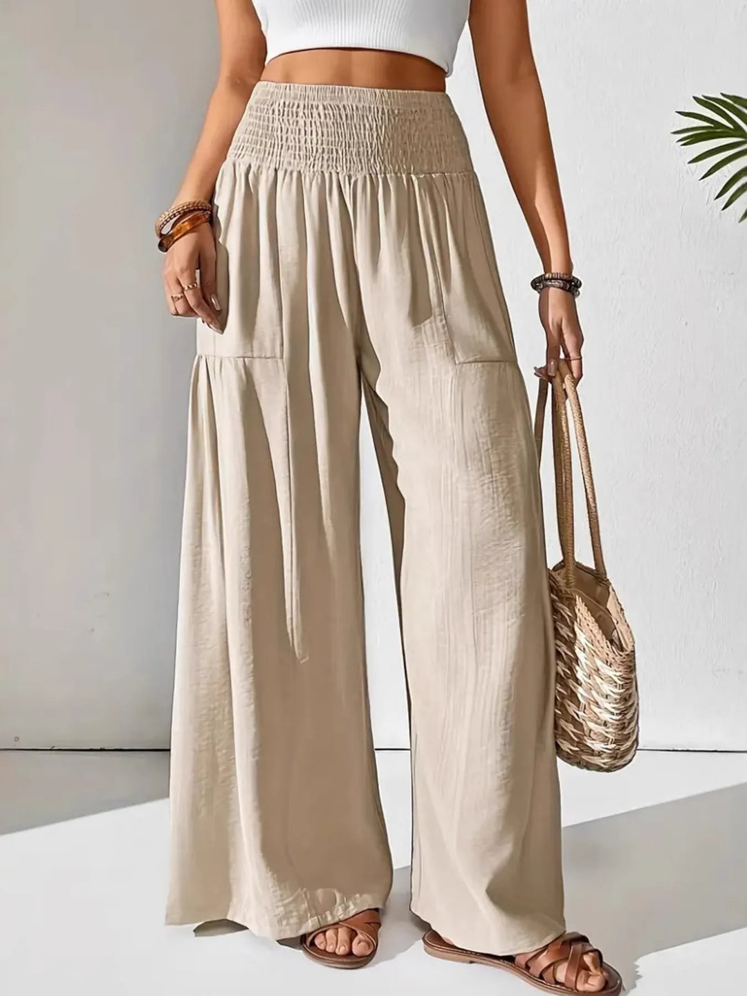 Women's smocked waist wide leg pants, comfortable & stylish for casual wear.