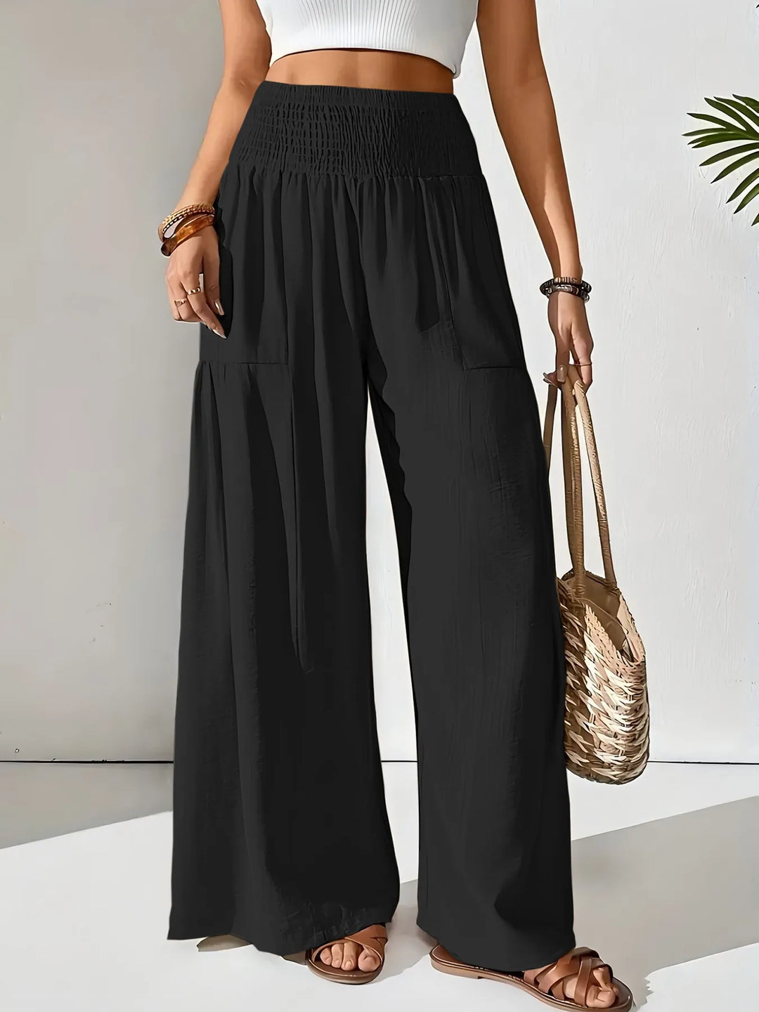 Versatile women's wide leg pants, smocked waist, great for casual, travel, or everyday fashion.