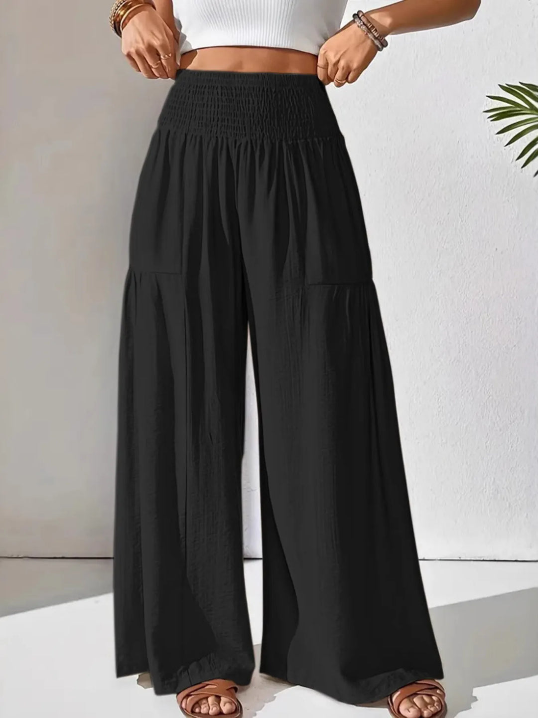 Flattering high-waist smocked wide leg pants for women, offering a loose, comfortable, and stylish fit.