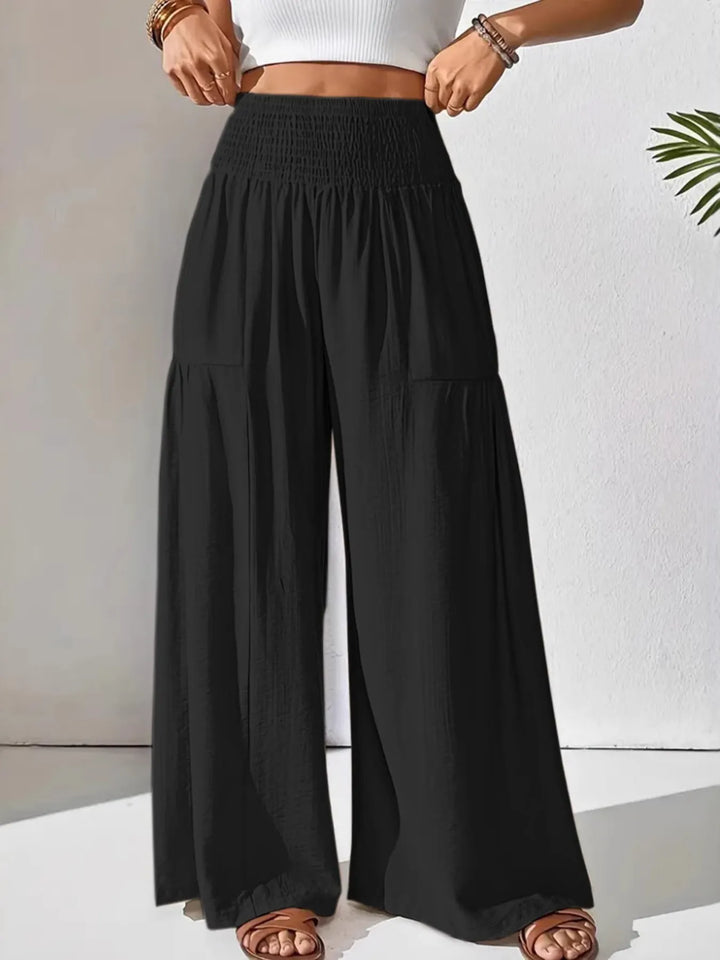 Flattering high-waist smocked wide leg pants for women, offering a loose, comfortable, and stylish fit.