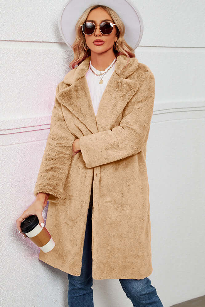Women's soft faux fur long teddy coat with elegant lapel. Perfect warm winter fashion outerwear, cruelty-free.