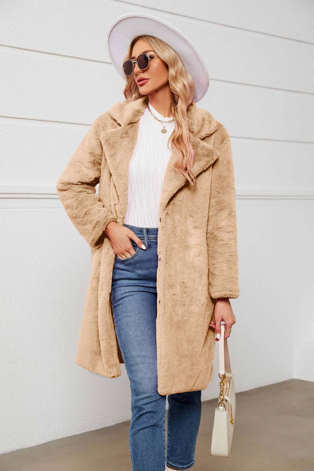 Luxurious cruelty-free faux fur long coat for women, featuring a stylish lapel. A warm & soft teddy jacket for winter.