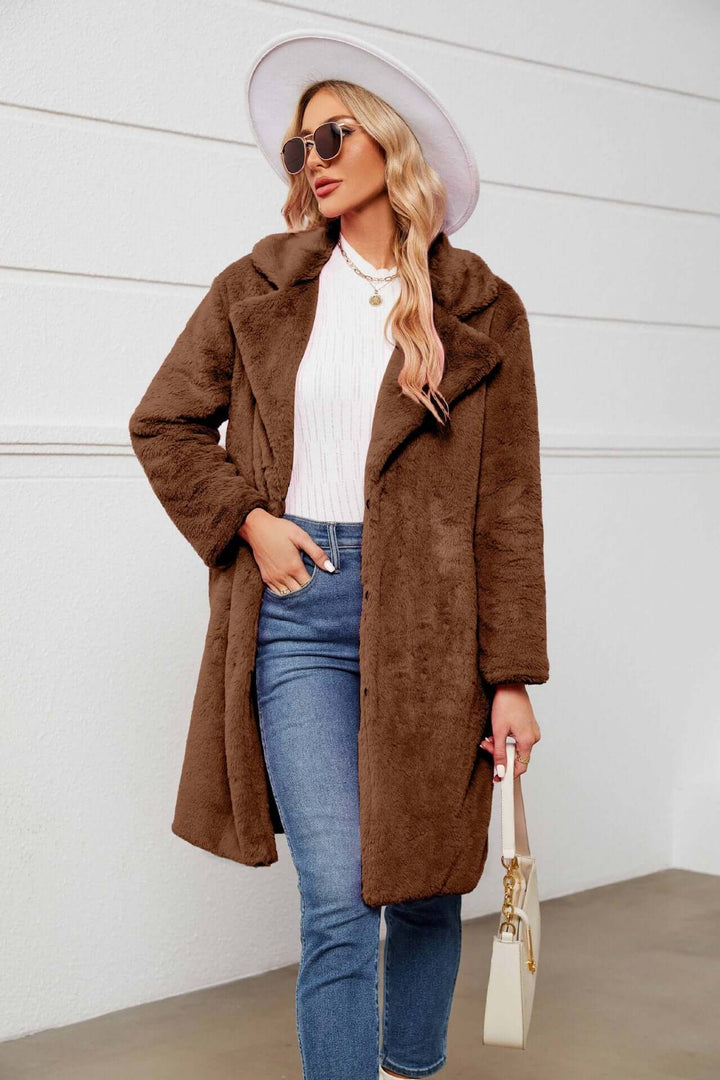 Cozy women's faux fur teddy coat with a long cut and stylish lapels. Soft, warm, and cruelty-free for winter comfort.