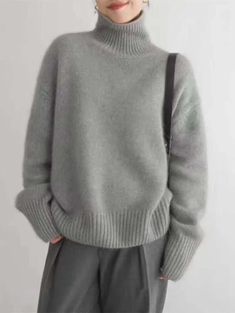 Cozy women's soft knit high neck sweater with long sleeves, ideal for fall & winter fashion, offering warmth & chic style.