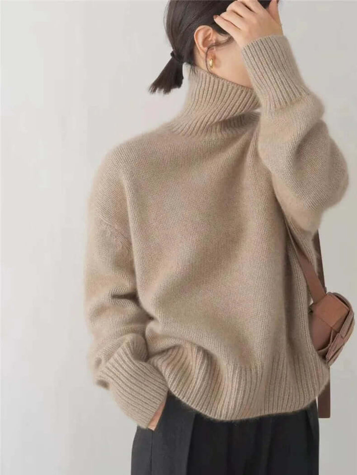 Elegant women's high neck knitted pullover sweater, featuring a soft texture, suitable for chic casual or office fall outfits.