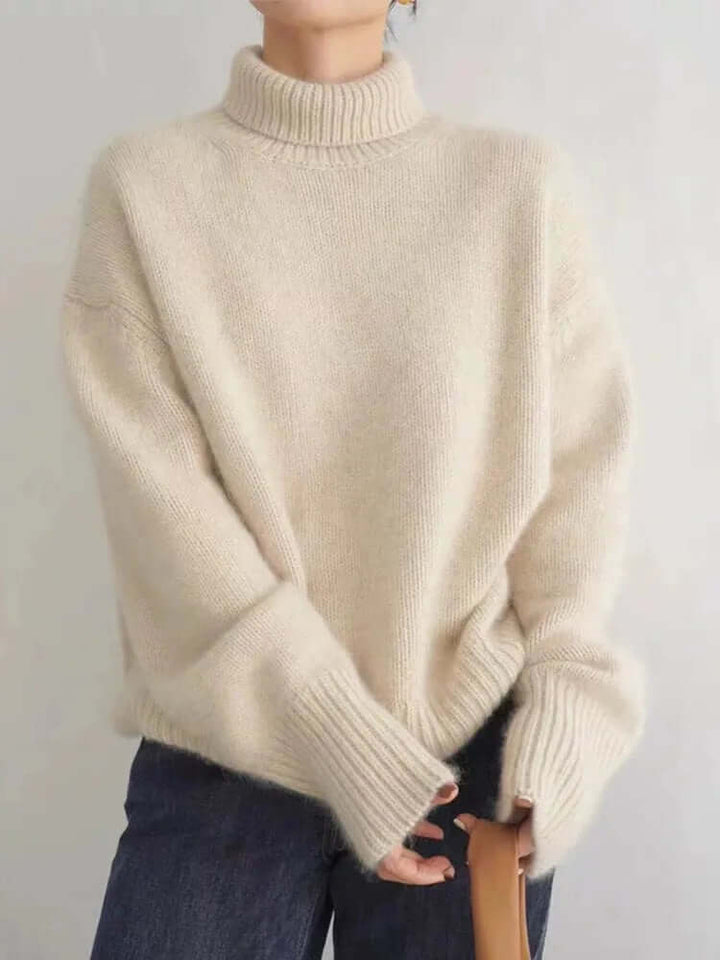 Warm & soft knitted high neck sweater for women, a cozy long-sleeve pullover perfect for chilly winter days & casual comfort.