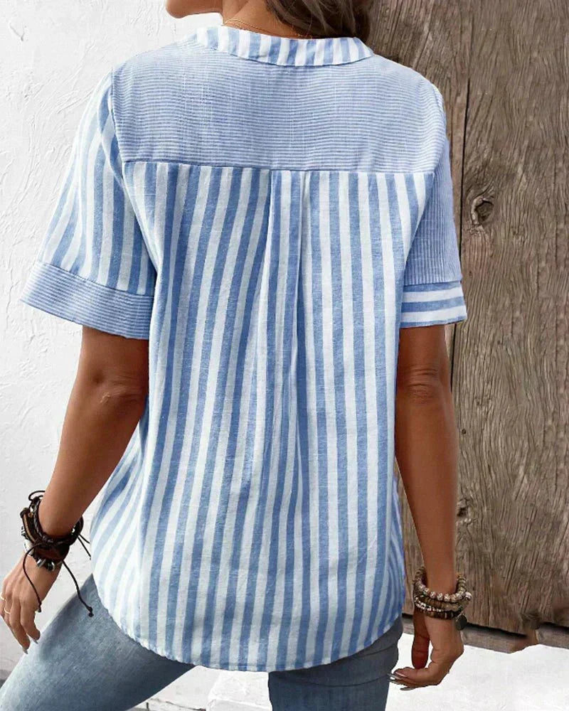 Chic women's striped top with a relaxed fit, offering effortless style and comfortable wearability.