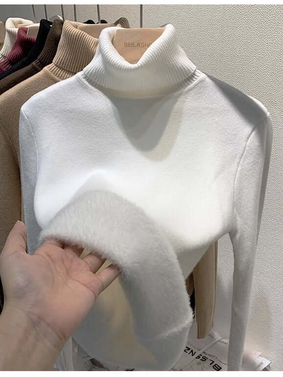 Cozy chic women's long-sleeve velvet turtleneck sweater. Soft & elegant for casual winter wear.