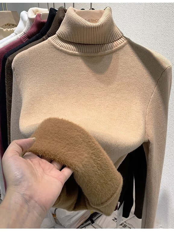 Soft velvet women's turtleneck sweater, a cozy & chic long-sleeve top for fashionable winter outfits.