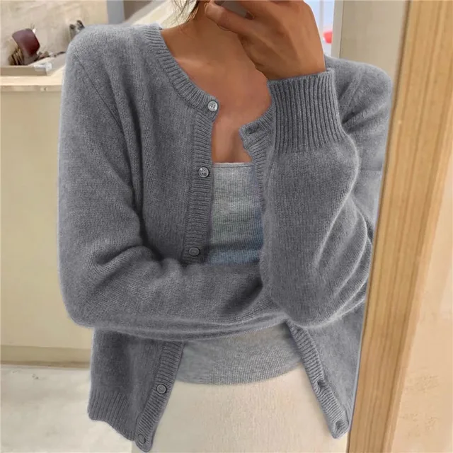 Cozy knit women's cardigan in a solid color, perfect for stylish everyday wear.