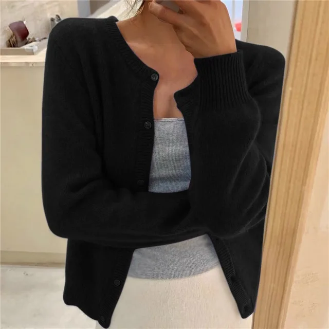 Versatile women's solid knit cardigan, an ideal layering piece for comfort & style.