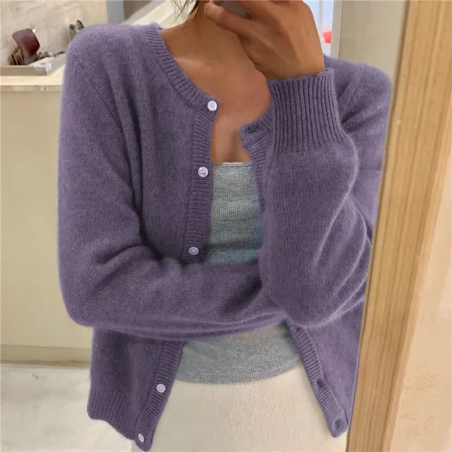 Elegant solid knit women's cardigan, perfect for comfortable and stylish everyday wear.