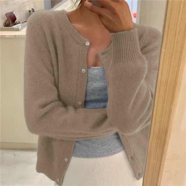 Solid knit women's cardigan, a stylish & comfortable one-size layering piece.