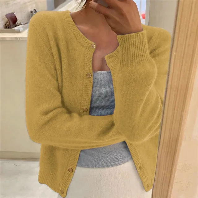 Soft solid knit women's cardigan, offering elegant comfort and versatile fashion.