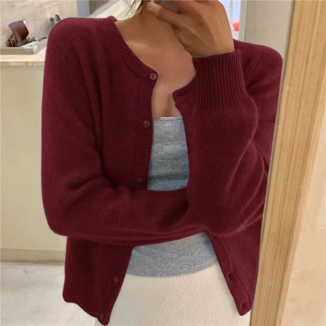 Essential women's solid knit cardigan, a cozy & stylish addition to any wardrobe.
