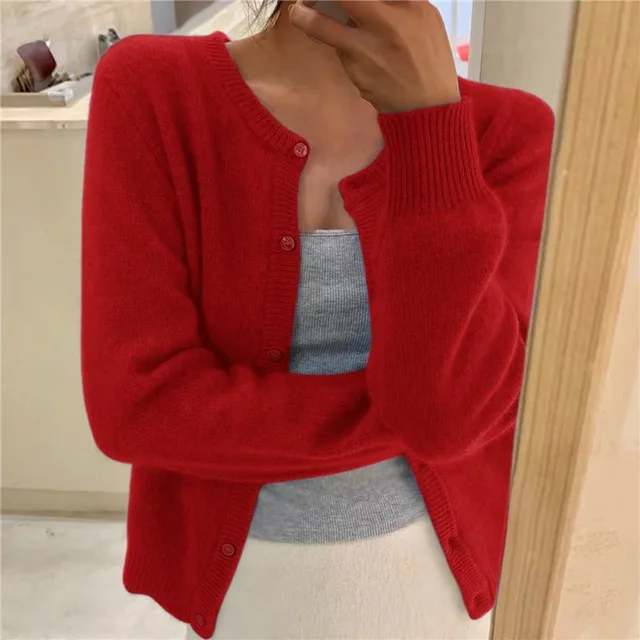 Fashionable solid knit women's cardigan, comfortable everyday wear, versatile layering.