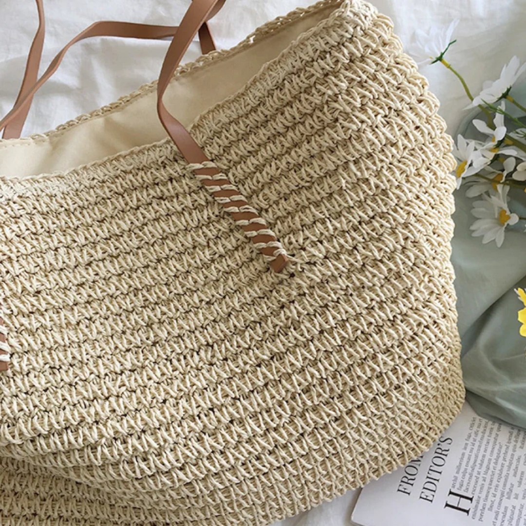 Chic brown woven shoulder bag for women, spacious and durable, complementing any daily outfit.
