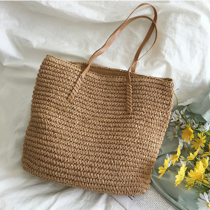 Brown woven women's shoulder bag, sturdy and spacious, ideal for versatile daily fashion.