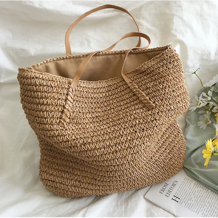 Women's white TerraWoven handbag, spacious and elegant with a sturdy shoulder strap.
