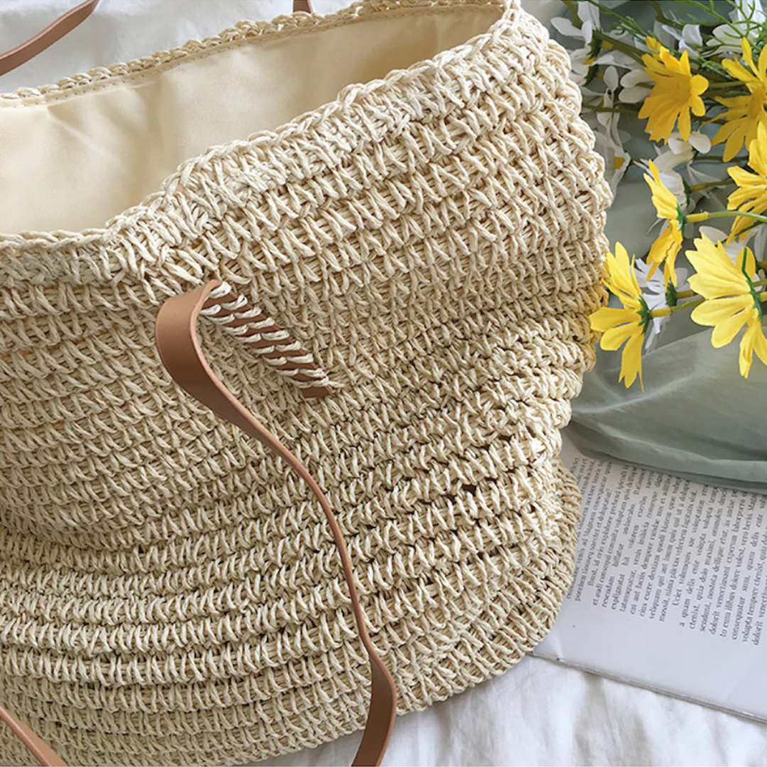 Detail of the sturdy shoulder strap on a women's elegant TerraWoven brown handbag.