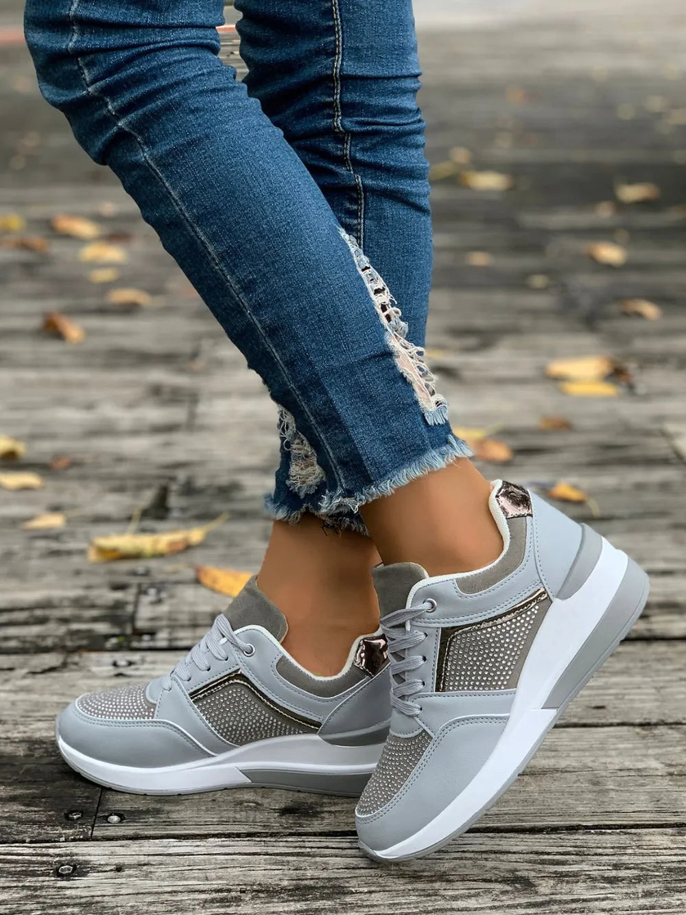 Close-up of sparkling women's platform sneakers, showing textured detail & comfortable sole.