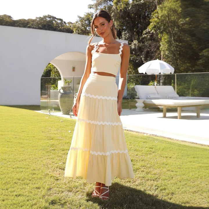 Casual chic women's two-piece set: strapless crop top & tiered maxi skirt. Perfect elegant summer wear.