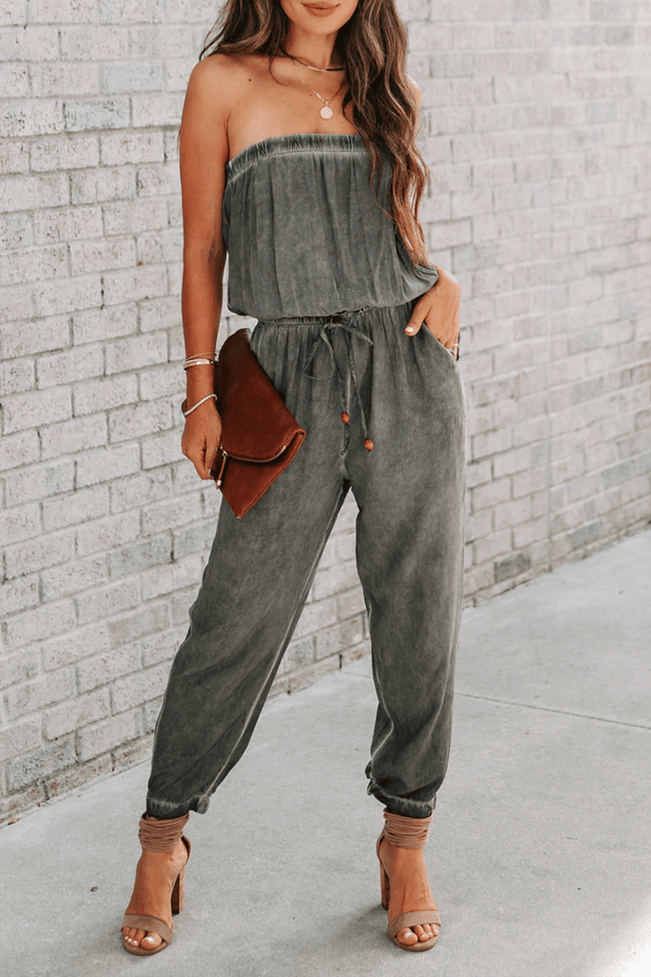 Fashionable women's polyester strapless drawstring jumpsuit, a comfortable one-piece for summer or chic events.