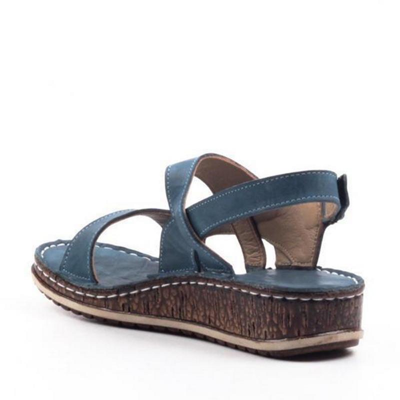 Pair of versatile women's summer wedge sandals with supportive strappy design and comfort