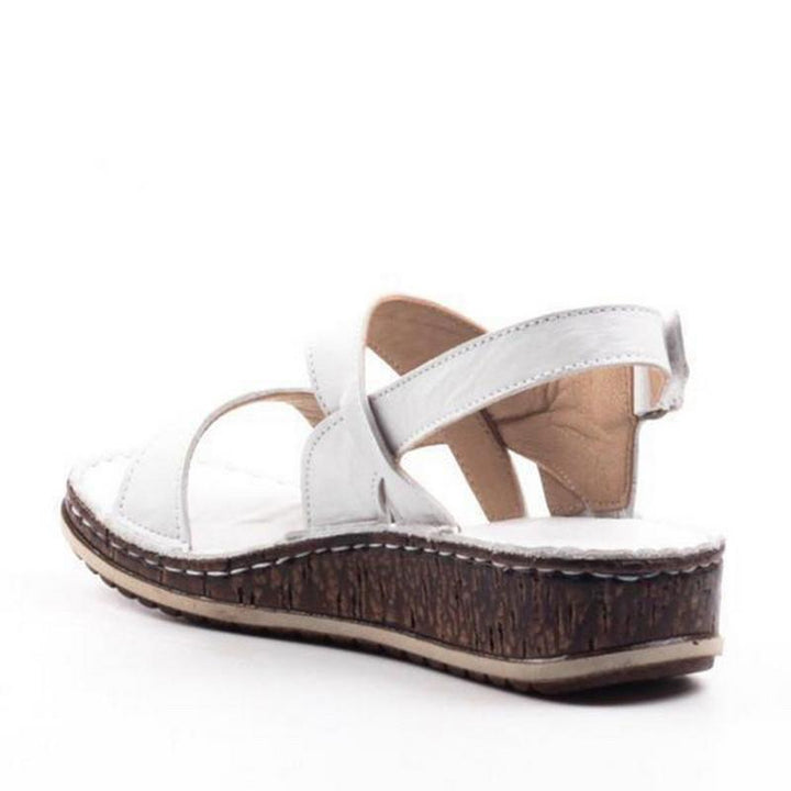 Front view of women's comfortable open-toe wedge sandals with stylish strappy details