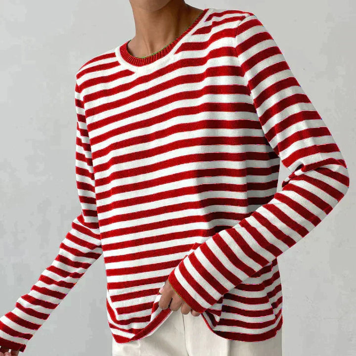 Stylish women's striped knit sweater. Long sleeve crew neck pullover, essential autumn fashion piece.