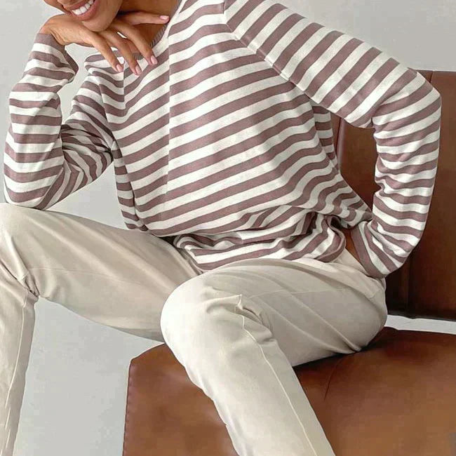 Soft knit striped sweater for women. Comfortable long sleeve, crew neck pullover, ideal for everyday wear.