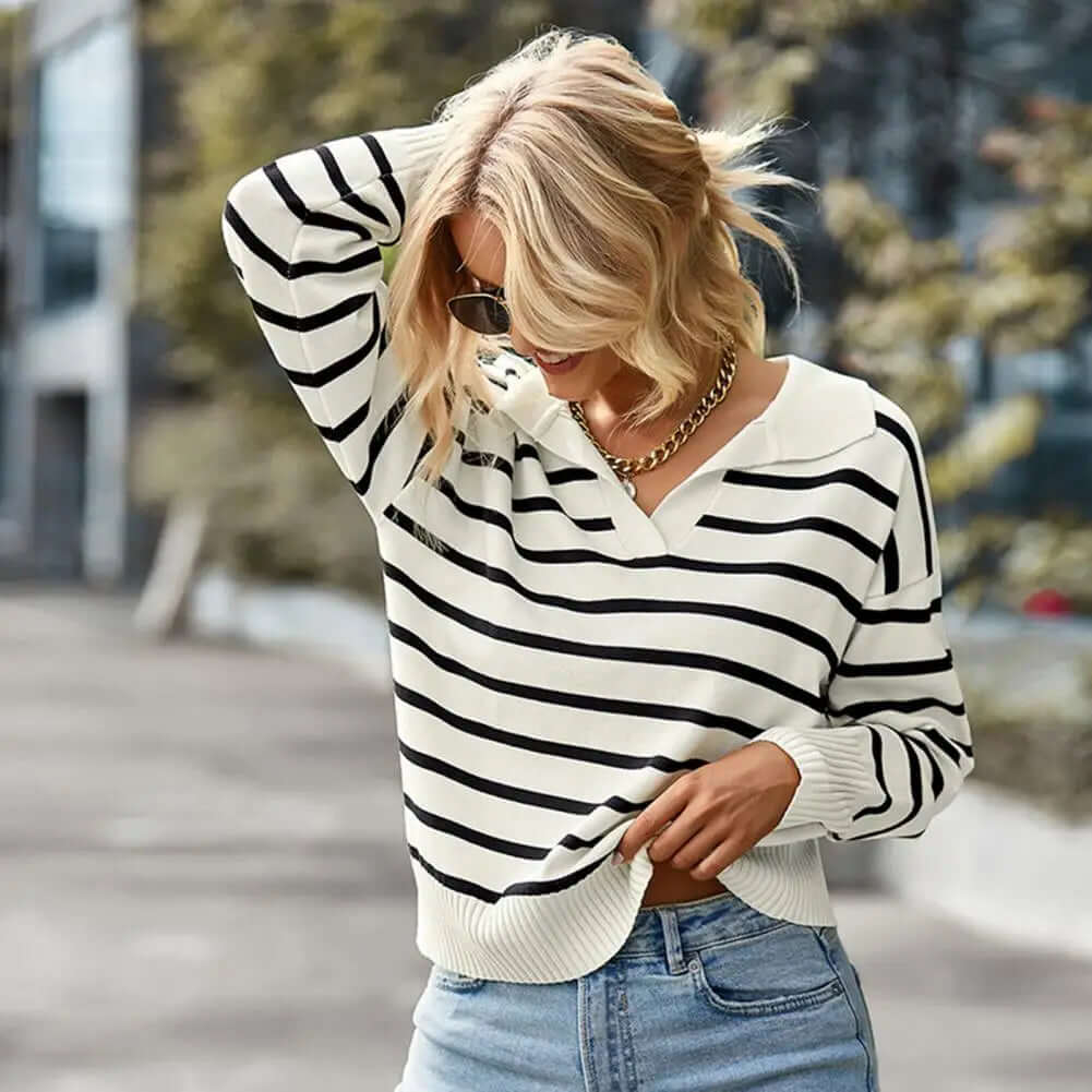 Striped knitted V-neck sweater for women. Long sleeve pullover jumper, a cozy and versatile fashion piece.