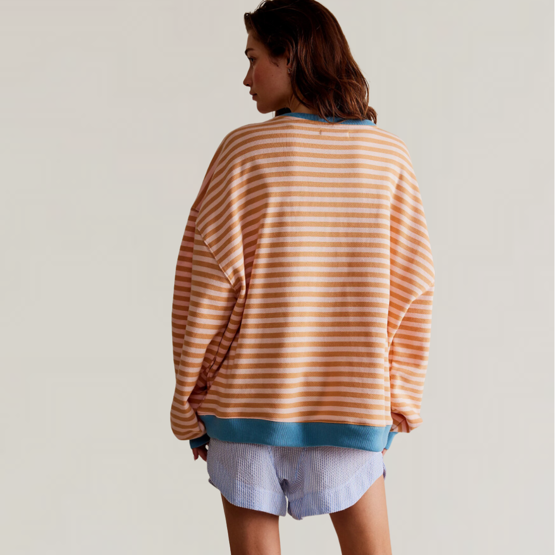 Comfortable women's striped oversized sweater, a stylish long sleeve top with a relaxed fit for casual wear.