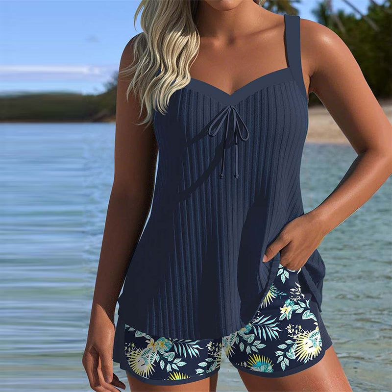 Women's striped tankini set with beach shorts, perfect two-piece swimwear for summer vacation.